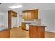 Well-appointed kitchen with granite countertops, wood cabinets, and island with sink at 4009 Riverstone Dr, Suwanee, GA 30024