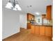 Open kitchen featuring wood cabinets, granite counters, and stainless steel appliances at 4009 Riverstone Dr, Suwanee, GA 30024