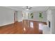 Bright living room with hardwood floors, fireplace, and views of the front yard at 4009 Riverstone Dr, Suwanee, GA 30024