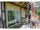 Sliding glass doors lead from the house to the back porch, which has stairs to the yard at 6991 Flagstone Dr, Austell, GA 30168