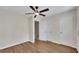 Spacious bedroom with new flooring, ceiling fan, walk-in closet, and neutral walls at 6991 Flagstone Dr, Austell, GA 30168
