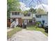 Attractive townhome showcasing a brick facade, front porch, and convenient parking at 6991 Flagstone Dr, Austell, GA 30168