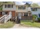 Cozy townhome featuring a brick facade and a welcoming front porch at 6991 Flagstone Dr, Austell, GA 30168