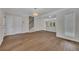 Spacious living room featuring hardwood floors, neutral paint, and ample natural light at 6991 Flagstone Dr, Austell, GA 30168