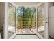 View through the French doors onto the outdoor patio at 6991 Flagstone Dr, Austell, GA 30168