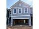 View of unfinished townhome exterior with spacious garage at 214 Seward Street Unit #94, Conyers, GA 30094