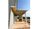 Unfinished patio with a fireplace surrounded by beautiful nature at 214 Seward Street Unit #94, Conyers, GA 30094