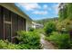 Enjoy the outdoors from the screened in back porch, surrounded by lush landscaping at 219 Cordova St, Woodstock, GA 30189