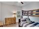 Comfortable bedroom featuring a bunk bed, dresser, and natural light, perfect for or guests at 219 Cordova St, Woodstock, GA 30189