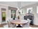 Elegant dining room with a round table, stylish chairs, and modern pendant lighting at 219 Cordova St, Woodstock, GA 30189