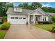 Charming single Gathering home with a lush front yard and a two-car garage at 219 Cordova St, Woodstock, GA 30189