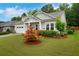 Charming single Gathering home with a lush front yard and a two-car garage at 219 Cordova St, Woodstock, GA 30189