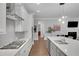 Gourmet kitchen featuring stainless steel appliances, a center island, and tile backsplash at 219 Cordova St, Woodstock, GA 30189