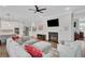 Comfortable living room with a fireplace, large sectional sofa, and stylish decor at 219 Cordova St, Woodstock, GA 30189