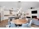 Spacious open living space connecting the dining area, kitchen, and living room for modern living at 219 Cordova St, Woodstock, GA 30189