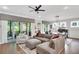Open-concept living space with a seamless flow between the living, dining, and outdoor areas at 219 Cordova St, Woodstock, GA 30189