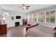 Spacious main bedroom with a ceiling fan, large windows with shutters, and hardwood floors at 219 Cordova St, Woodstock, GA 30189