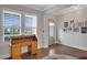 Bright office space with wooden desk, shuttered windows, and natural light at 219 Cordova St, Woodstock, GA 30189
