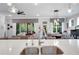 Open-concept living space with natural light, a kitchen island, and a view into the living area at 219 Cordova St, Woodstock, GA 30189