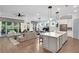 Open-concept living with a kitchen island, dining area, and cozy living space with natural lighting at 219 Cordova St, Woodstock, GA 30189