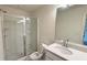 Bathroom featuring glass shower, modern vanity with light countertop, mirror and toilet at 32 S Auburn Landing Pl, Auburn, GA 30011