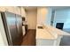 Sleek townhouse kitchen featuring stainless steel appliances and quartz countertops at 32 S Auburn Landing Pl, Auburn, GA 30011