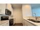Well-appointed kitchen with stainless steel appliances and quartz countertops at 32 S Auburn Landing Pl, Auburn, GA 30011