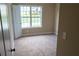 Inviting bedroom featuring neutral walls, plush carpeting, and large windows for natural light at 4527 Berline Dr, Lithonia, GA 30038