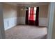 Cozy dining room with elegant wainscoting, soft carpet, and natural light from the window at 4527 Berline Dr, Lithonia, GA 30038