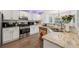 Kitchen featuring granite counters, stainless appliances, white cabinetry, and tile backsplash at 4147 Pinehurst Valley Dr, Decatur, GA 30034