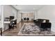 Open living room with wood floors, and large windows that bring in lots of natural light at 4147 Pinehurst Valley Dr, Decatur, GA 30034