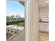 Balcony view of the city skyline, accessible from the kitchen with white cabinets and modern finishes at 587 Virginia Ne Ave # 609, Atlanta, GA 30306