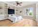 Bright bedroom with hardwood floors, built-in shelving, and a view at 587 Virginia Ne Ave # 609, Atlanta, GA 30306
