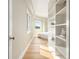 Bedroom hallway features built-in shelving and light hardwood floors at 587 Virginia Ne Ave # 609, Atlanta, GA 30306