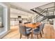 Dining area leading to a kitchen with stainless steel appliances and white cabinets at 587 Virginia Ne Ave # 609, Atlanta, GA 30306