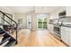 Bright kitchen with stainless steel appliances, marble backsplash, and light hardwood floors at 587 Virginia Ne Ave # 609, Atlanta, GA 30306