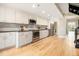 Modern kitchen with white cabinets, stainless steel appliances, and hardwood floors at 587 Virginia Ne Ave # 609, Atlanta, GA 30306