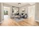 Inviting living room with hardwood floors, a large mirror, and access to a balcony at 587 Virginia Ne Ave # 609, Atlanta, GA 30306