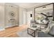 Hardwood floors, large mirror, comfortable seating, and access to a staircase at 587 Virginia Ne Ave # 609, Atlanta, GA 30306