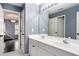Well-lit bathroom with a double vanity and views into an adjacent bedroom at 650 Garden Wilde Place, Roswell, GA 30075