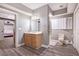 Spacious bathroom with vanity, sink, and white cabinets with a toilet and shower at 650 Garden Wilde Place, Roswell, GA 30075