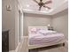 Cozy bedroom with a tray ceiling, closet, and comfortable queen-sized bed at 650 Garden Wilde Place, Roswell, GA 30075