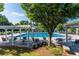 Community pool with a arbor, lounge chairs, and picnic tables for residents to enjoy at 650 Garden Wilde Place, Roswell, GA 30075