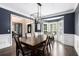 Formal dining room featuring modern chandelier and bright bay window at 650 Garden Wilde Place, Roswell, GA 30075