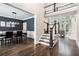 Open foyer showcasing hardwood floors, staircase, and a view into the dining and living areas at 650 Garden Wilde Place, Roswell, GA 30075