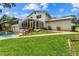 Large backyard featuring a sparkling pool, and well-maintained lawn at 6628 Londonderry Dr, Morrow, GA 30260