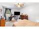 Cozy bedroom featuring carpet, furniture and a ceiling fan at 6628 Londonderry Dr, Morrow, GA 30260