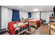 Spacious bedroom with two beds, hardwood flooring and natural light at 6628 Londonderry Dr, Morrow, GA 30260