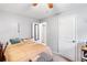 Minimalist bedroom with neutral carpet, a queen bed and open doorways at 6628 Londonderry Dr, Morrow, GA 30260