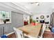 Inviting dining room featuring a wooden table with a view of the kitchen window at 6628 Londonderry Dr, Morrow, GA 30260